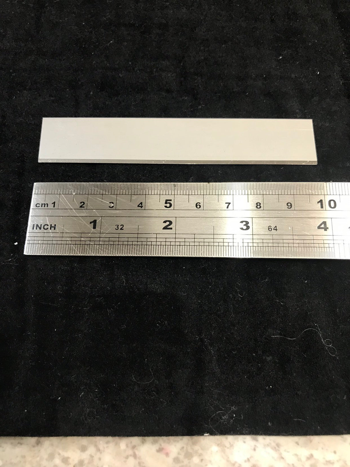 10cm or 100mm metal blade for polymer clay displayed with ruler in cm and inches